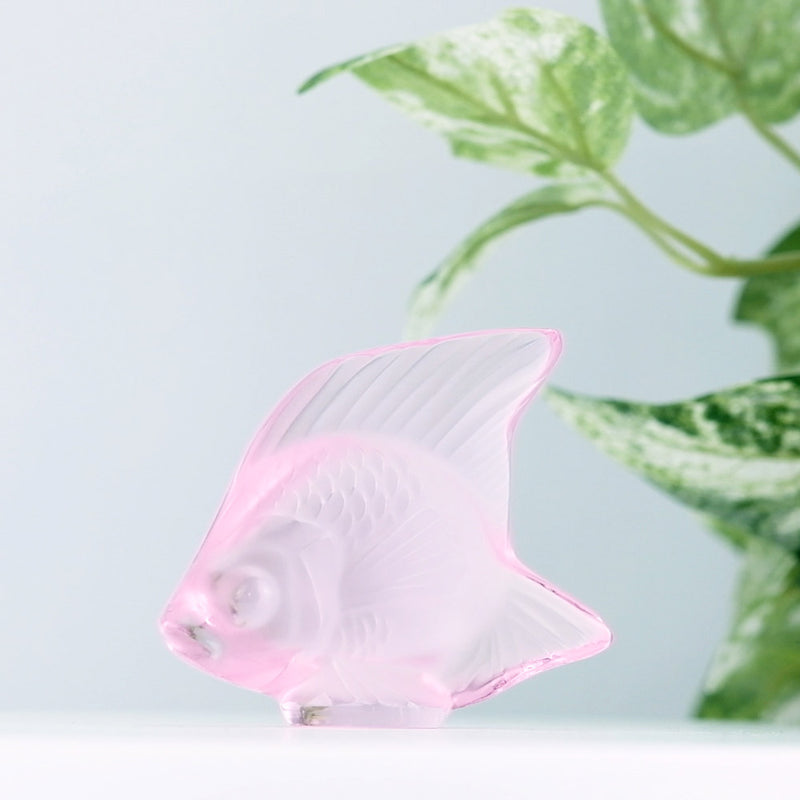 Lalique Pink Fish with plants in the background