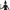 Action figure of a witch character with green skin, black outfit, and broom on a white background