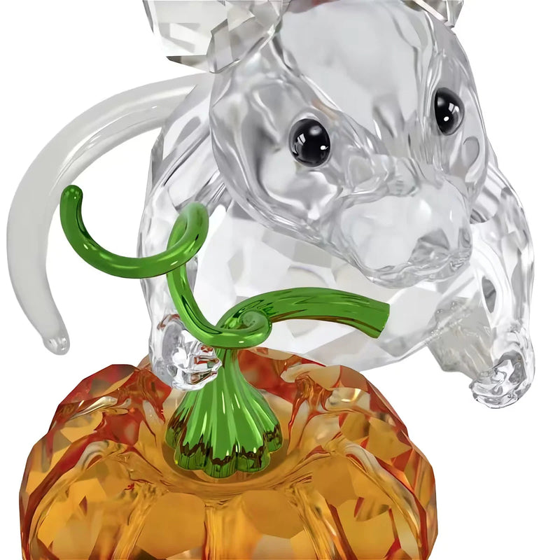 Faceted crystal bear figurine with green collar and orange jack-o'-lantern