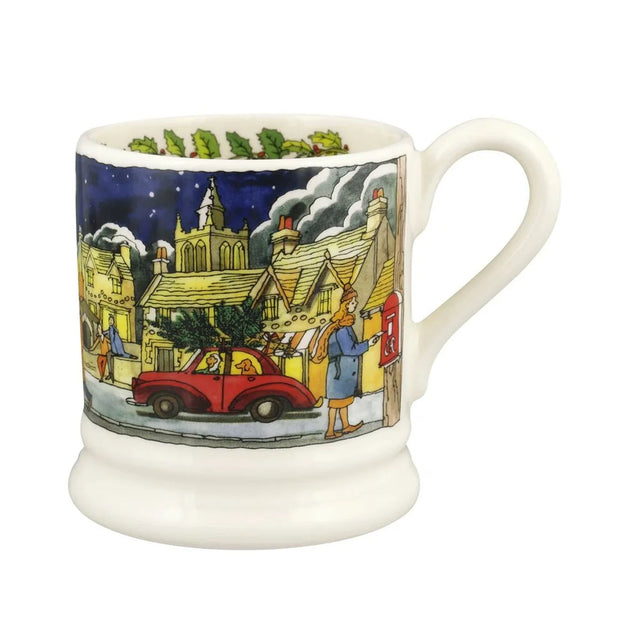 1/2 pint ceramic mug with blue village scene, yellow roofs, and red car illustration