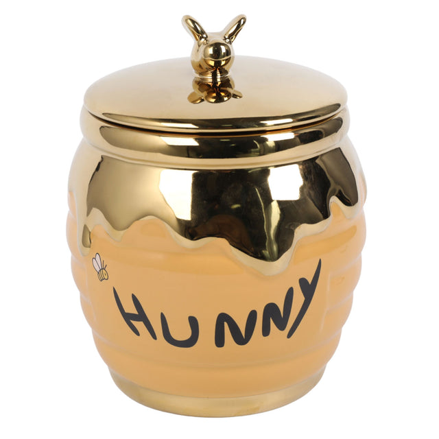 Gold cookie jar with round lid and honey-themed Pooh-style graphic