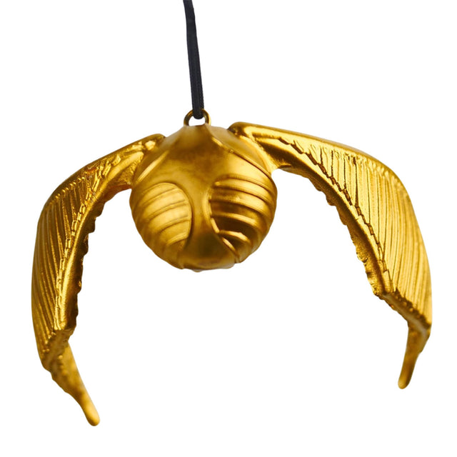 Gold snitch-shaped ornament with two curved wings and hanging string