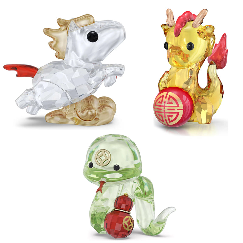 Swarovski crystal animal figurine set with a clear horse, gold dragon, and green snake