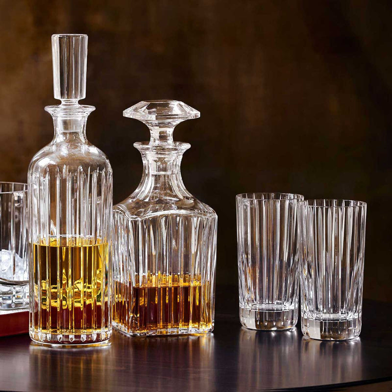 Set of 2 Baccarat Harmonie Highball Glasses displayed with Baccarat Decanters