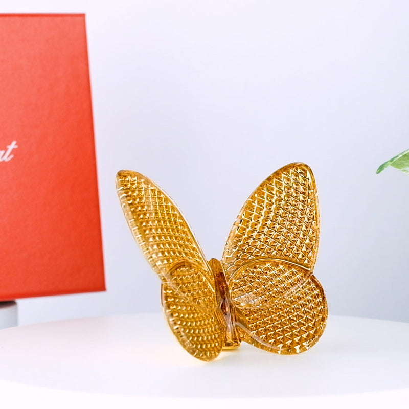 with Baccarat Papillon Lucky Diamond Gold box and plant in the background