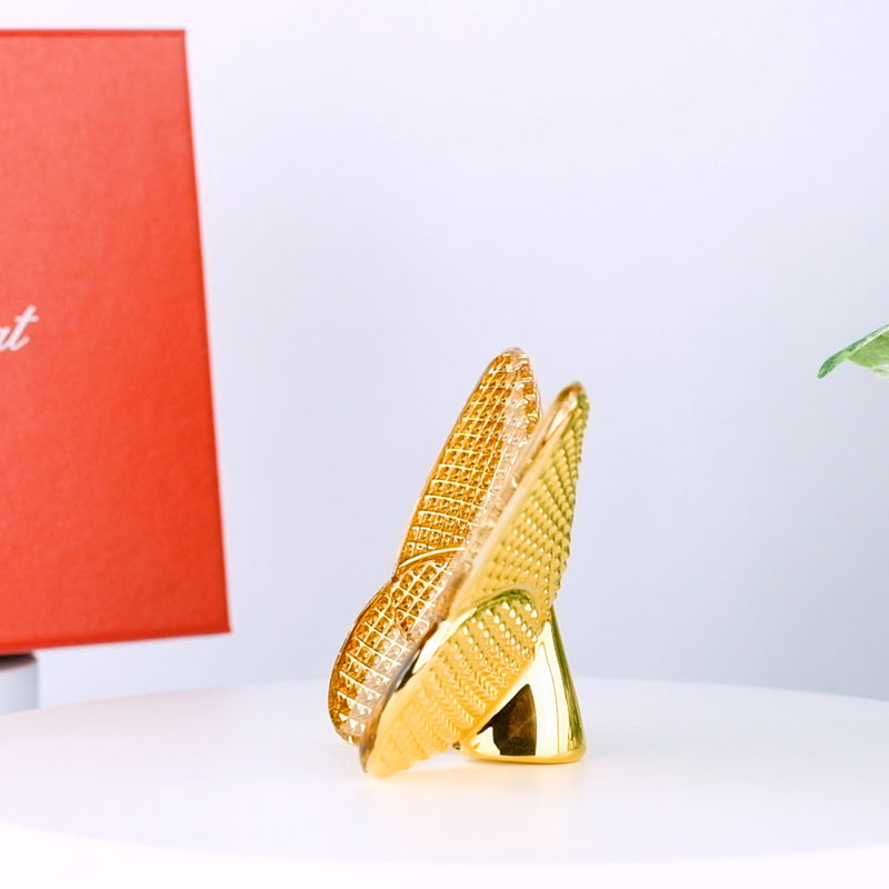  with Baccarat Papillon Lucky Diamond Gold box and plant in the background