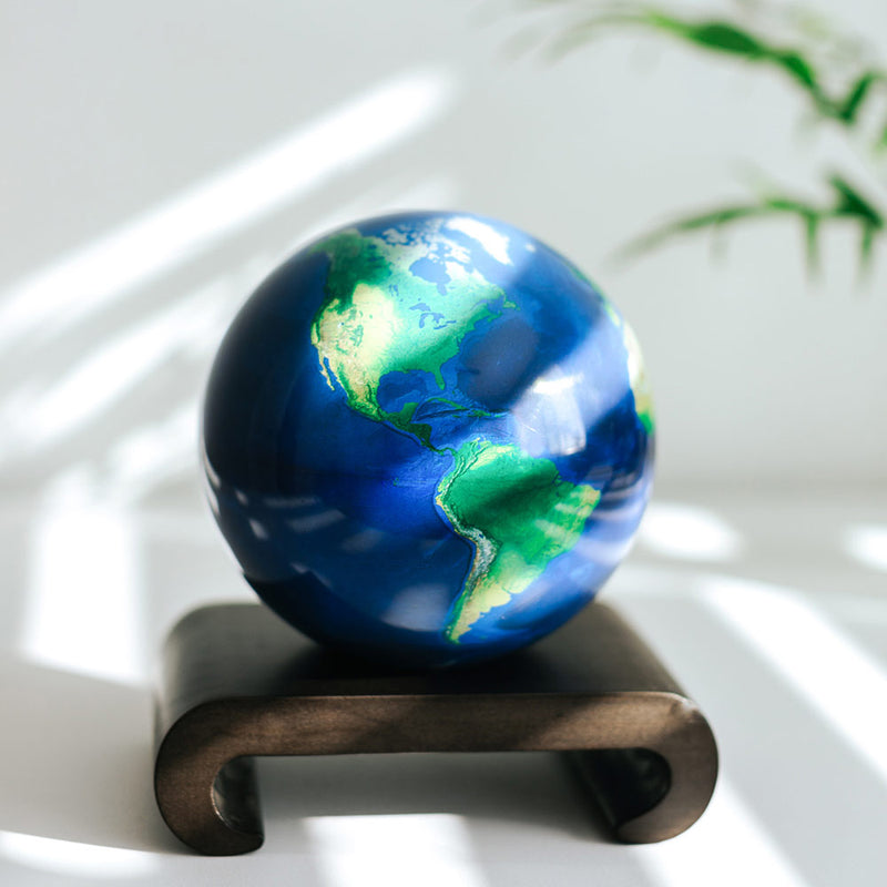 Earth Mova Globe 8.5 inch displayed on a wooden base