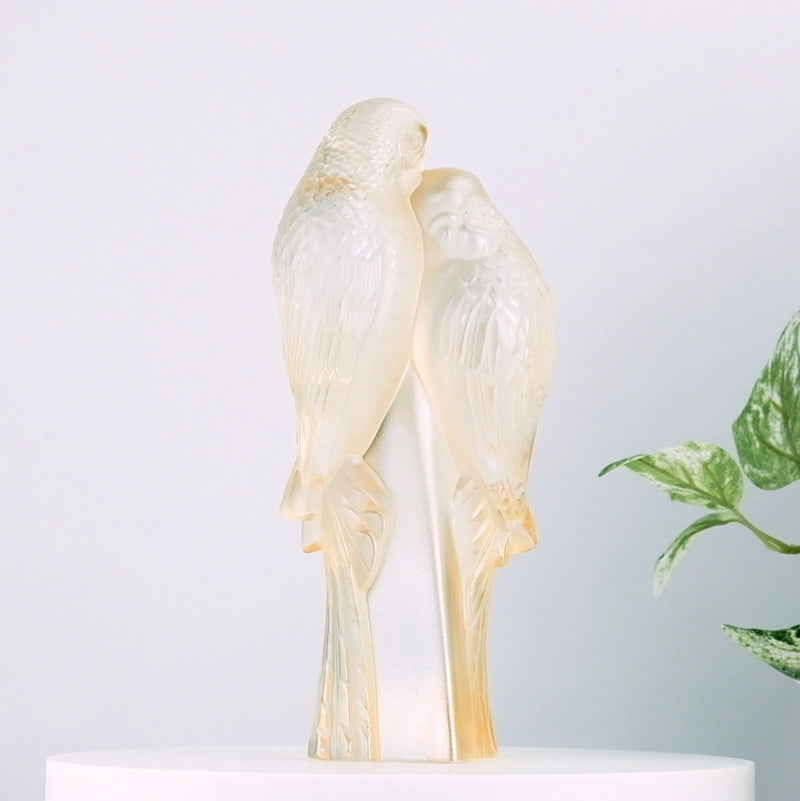 Lalique 2 Parakeets Gold Luster Crystal Sculpture with plants in the background