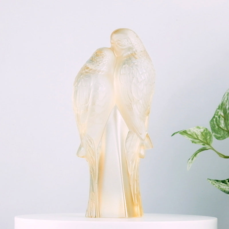 Lalique 2 Parakeets Gold Luster Crystal Sculpture with plants in the background