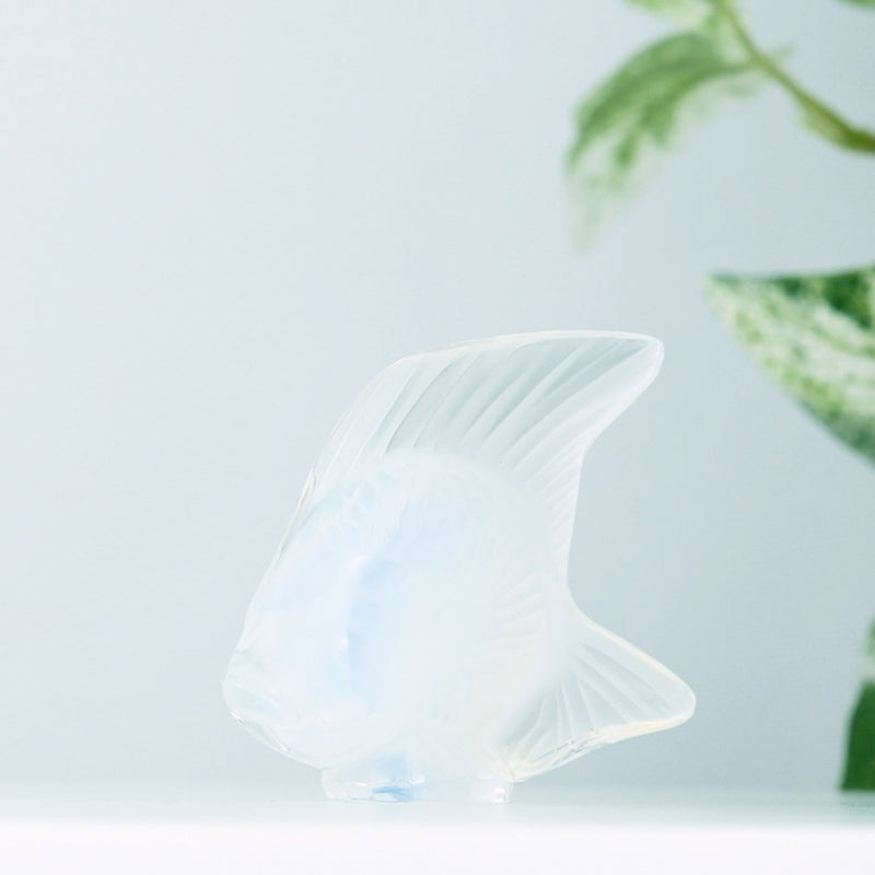 Lalique Opalescent Fish with plants in the background