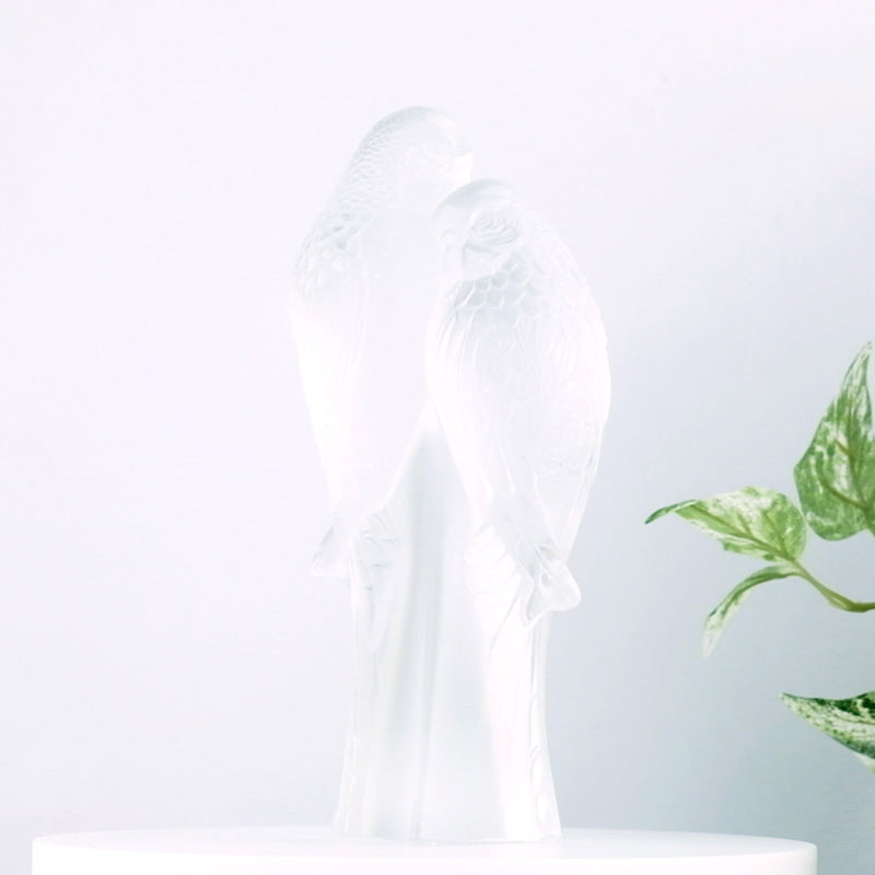 Lalique Two Parakeets with plants in the background