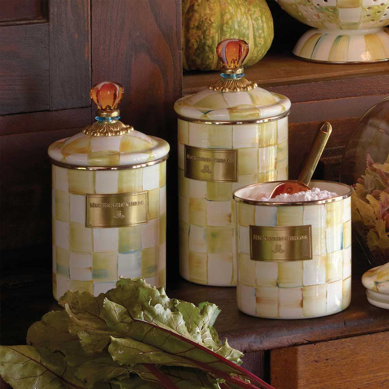 Mackenzie Childs Parchment Enamel Canisters in three sizes in a pantry setting