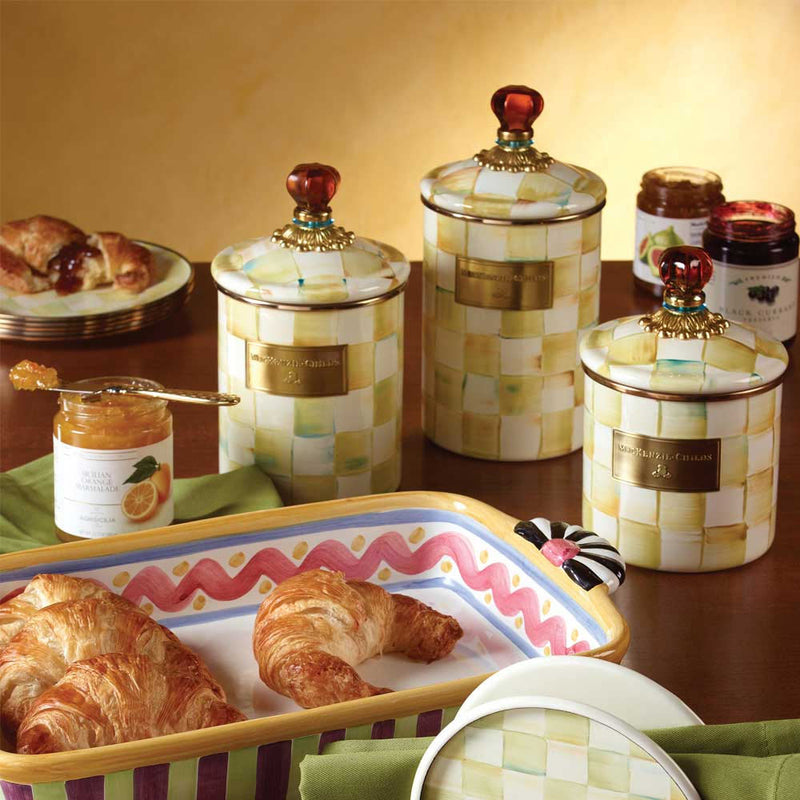 Mackenzie Childs Parchment Enamel Canisters in three sizes in a breakfast setting