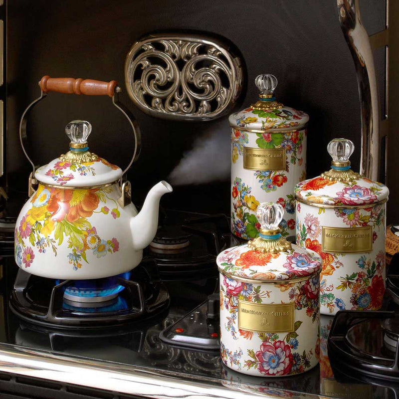Mackenzie Childs White Flower Market Medium Canister displayed with other Mackenzie Childs Flower Market tea items