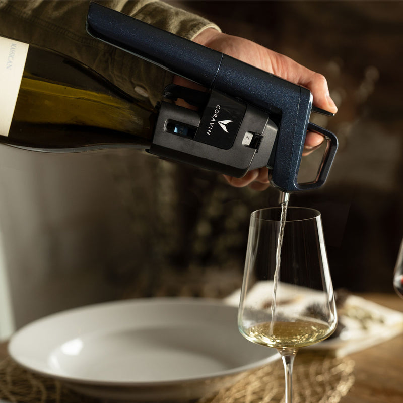 Coravin Timeless Six+ wine preservation device pouring wine from a bottle into a glass