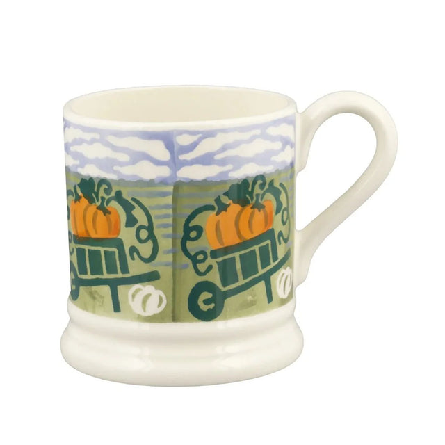 1/2 pint ceramic mug with blue-and-green pumpkin icons and cloud sky panel