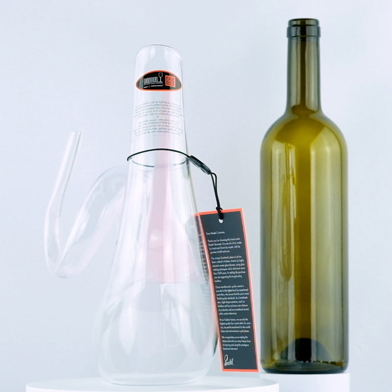 Riedel Crystal Pink Curly Decanter with red wine bottle