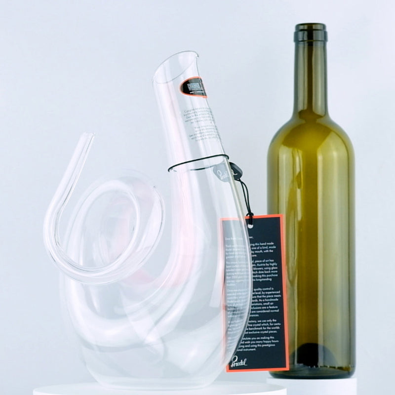 Riedel Crystal Pink Curly Decanter with red wine bottle