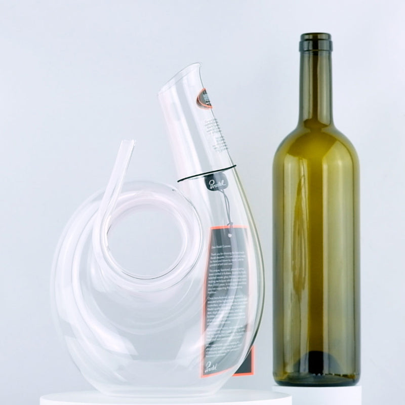 Riedel Crystal Pink Curly Decanter with red wine bottle