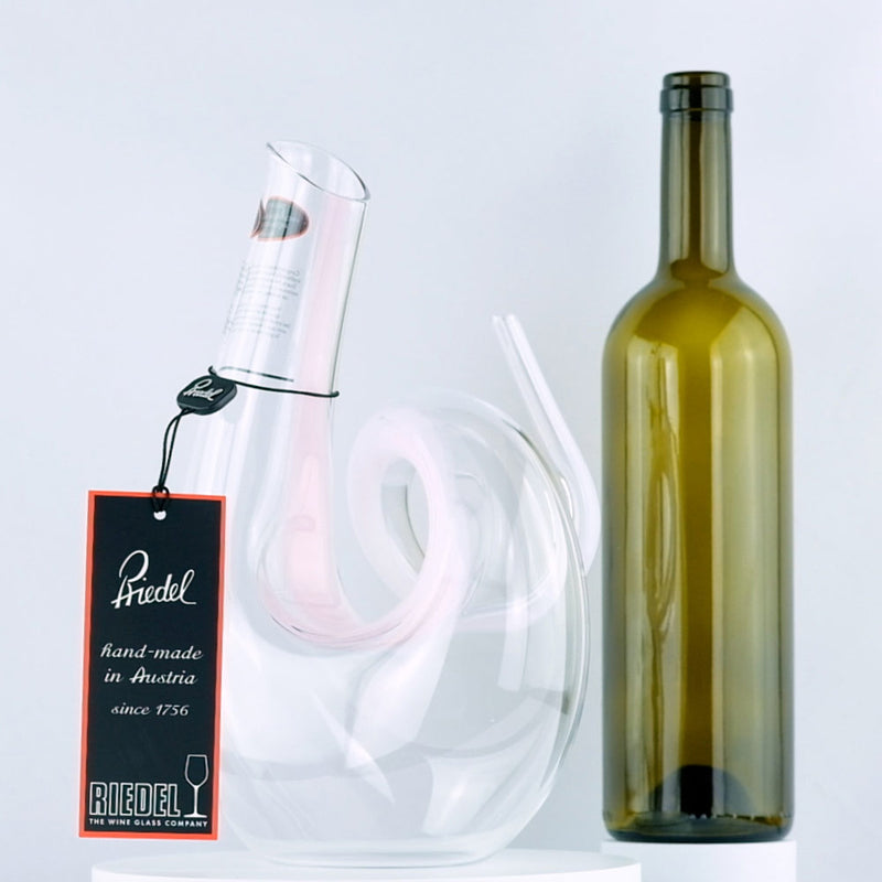 Riedel Crystal Pink Curly Decanter with red wine bottle