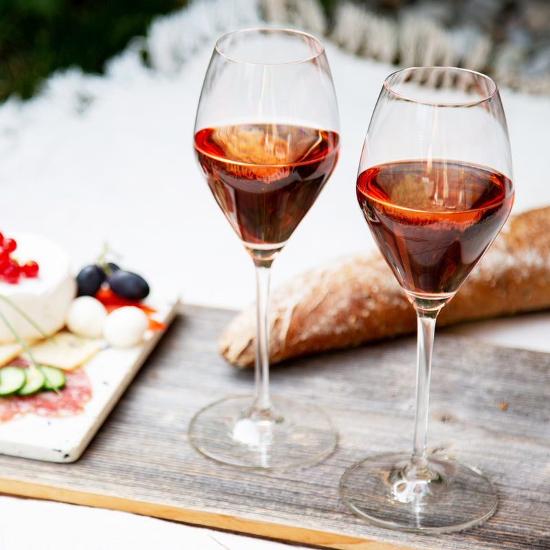 Set of Four Riedel Extreme Rose Champagne Glasses with bread and olives