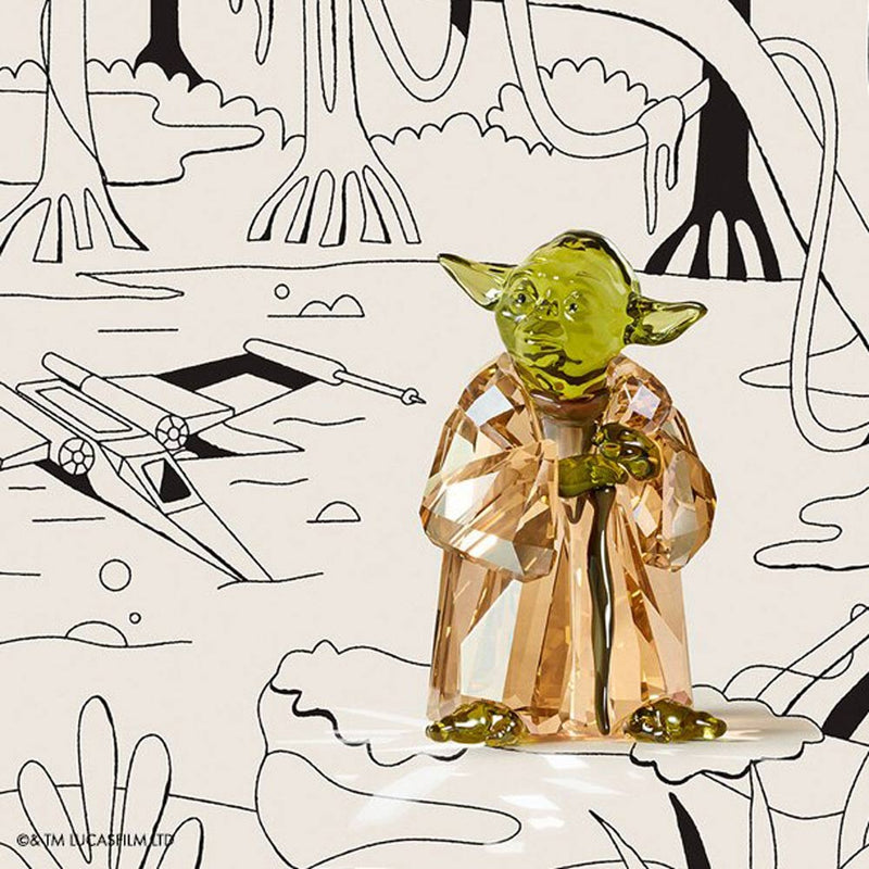 Swarovski Star Wars Master Yoda Crystal Figurine in a cartoon setting