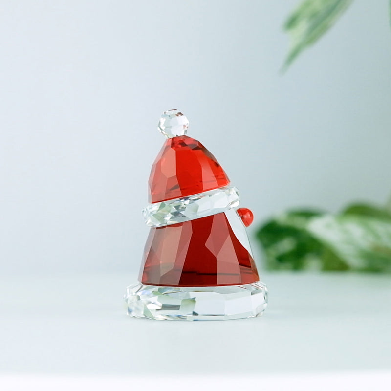 Swarovski Holiday Cheers Small Santa Claus with a plant in the background
