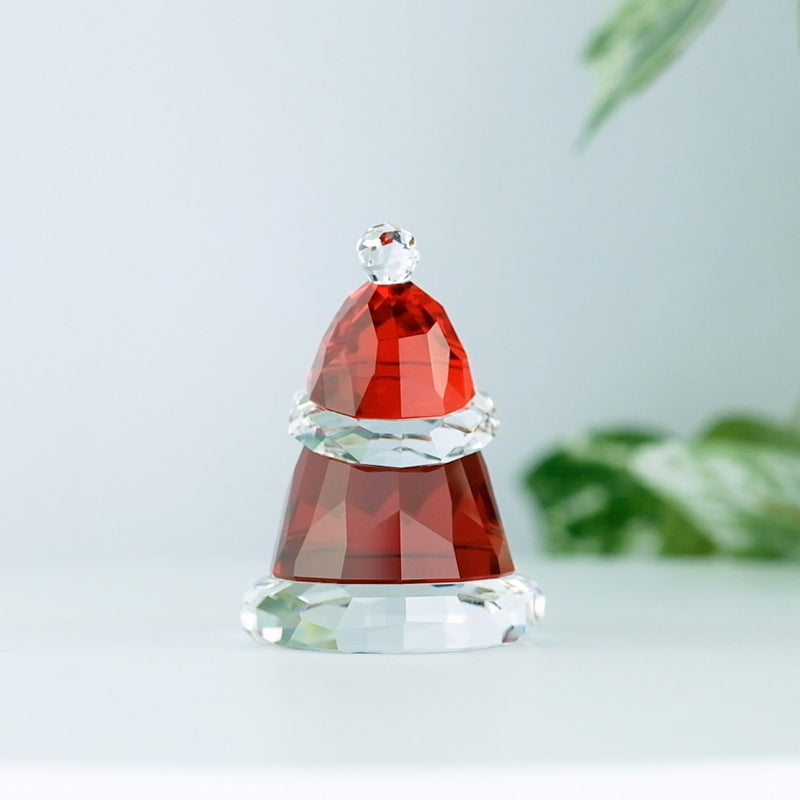 Swarovski Holiday Cheers Small Santa Claus with a plant in the background