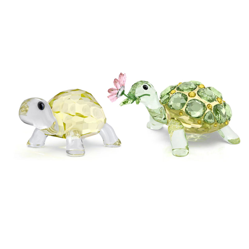 Swarovski Idyllia tortoise figurine set with a pale yellow crystal shell and a green jeweled tortoise