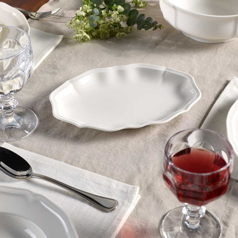 Villeroy & Boch Manoir 24cm Pickle Dish on a dining table with Villeroy & Boch Manoir bowls and plates and Villeroy & Boch Glasses