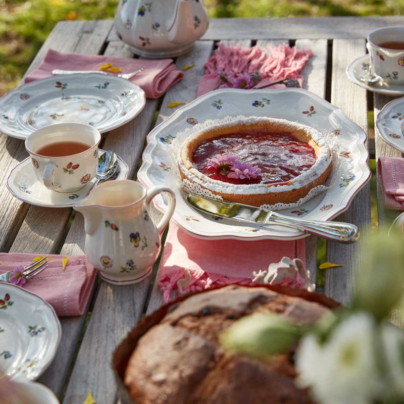 Villeroy & Boch Petite Fleur 44cm Oval Platter on a garden table laid for tea and cake with Villeroy & Boch Petite Fleur teacups