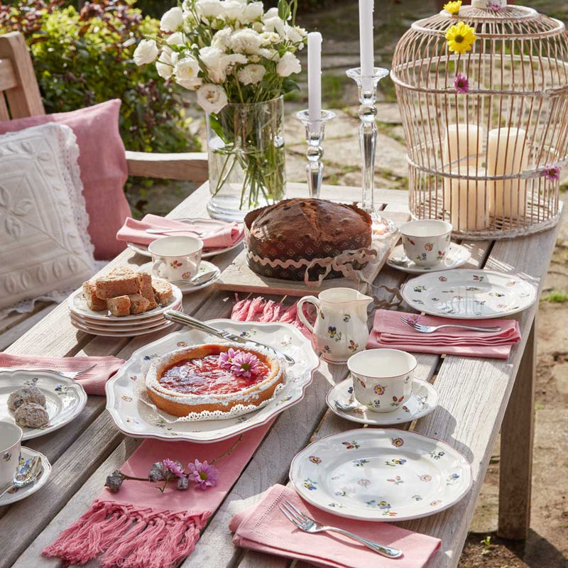 Villeroy & Boch Petite Fleur 0.25l Creamer on a garden table laid with the Villeroy & Boch Petite Fleur range