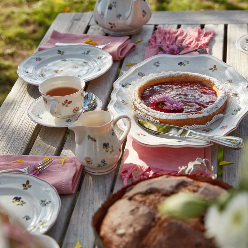 Villeroy & Boch Petite Fleur 17cm Breakfast Cup Saucer with Villeroy & Boch Petite Fleur teacup and teapot on a garden table