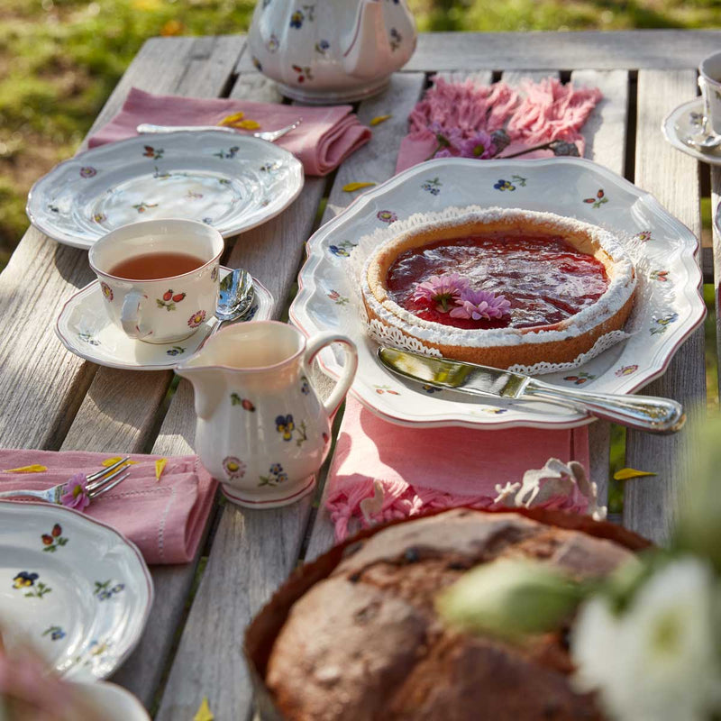 Villeroy & Boch Petite Fleur 26cm Flat Plate with other Villeroy & Boch Petite Fleur items on a garden table
